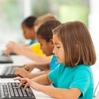 Elementary students working at computers