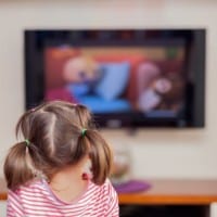 Photo of girl watching TV