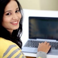 Female Student Using Laptop