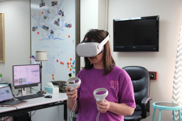 Student using virtual reality headset.