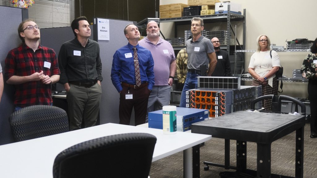 Small group of subscribers on a tour of the Network Operations Center