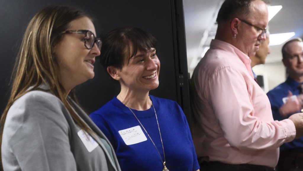 Cassie Spindle, Troy Milligan and a third reception guest